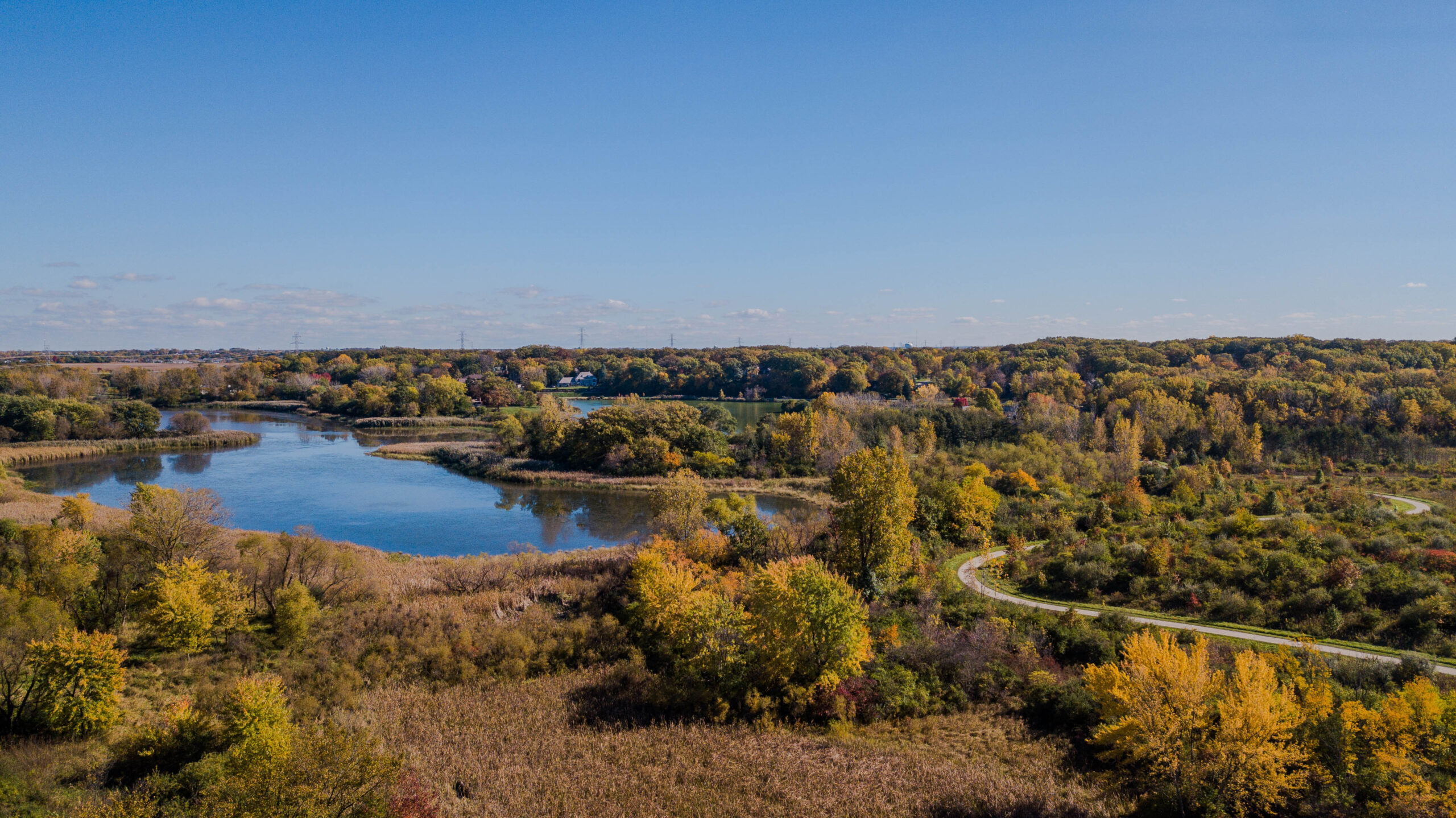 Drone aerial landscape photo showcasing public park and lake